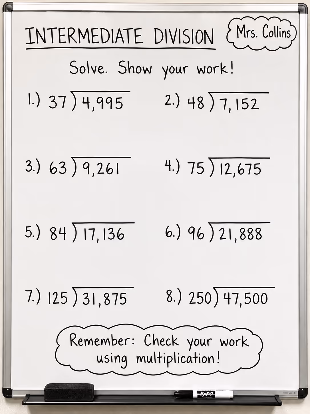 whiteboard with medium division problems
